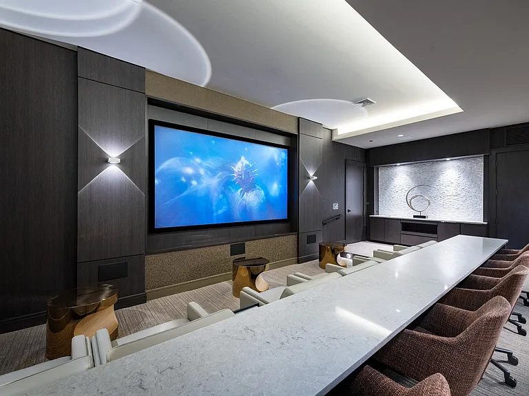 Our media room features an HD projector and theater-style seating.