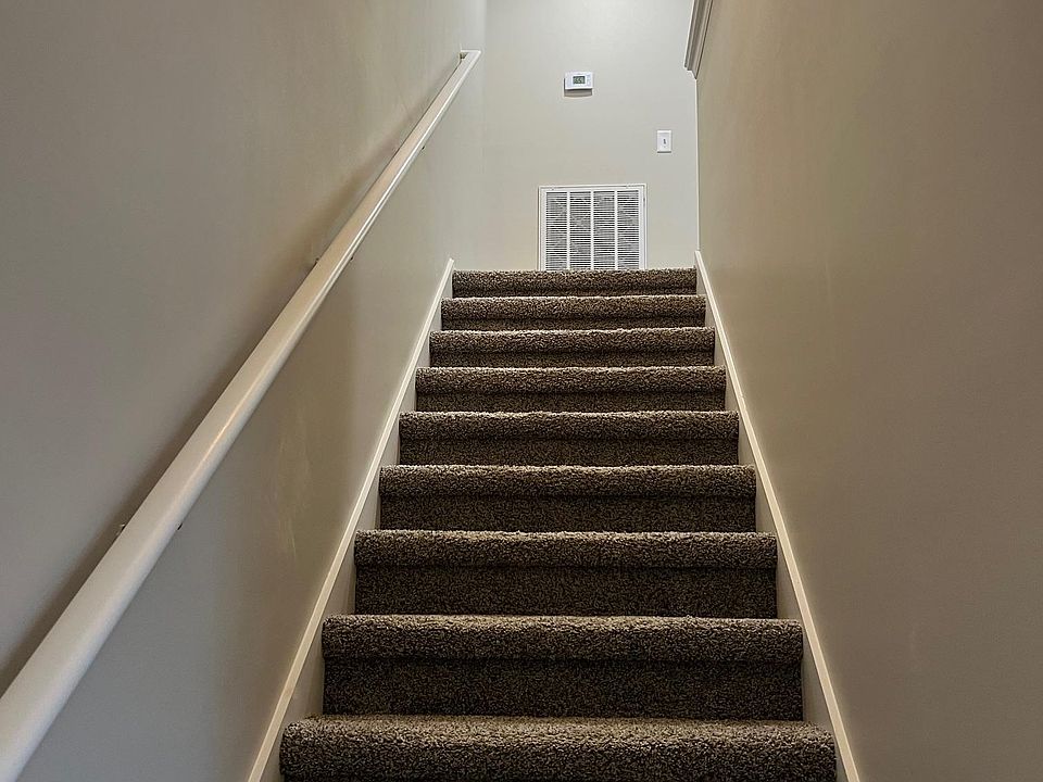 upstairs to bedrooms and full bathroom.