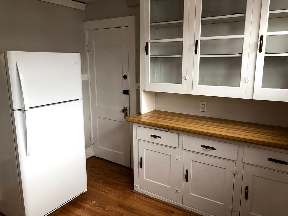 Kitchen features new appliances, glass cabinets along with ample counter and cabinet space.