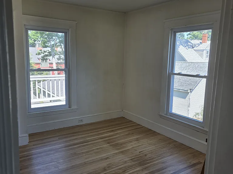 Bedroom off dining room and view of deck. Two closets