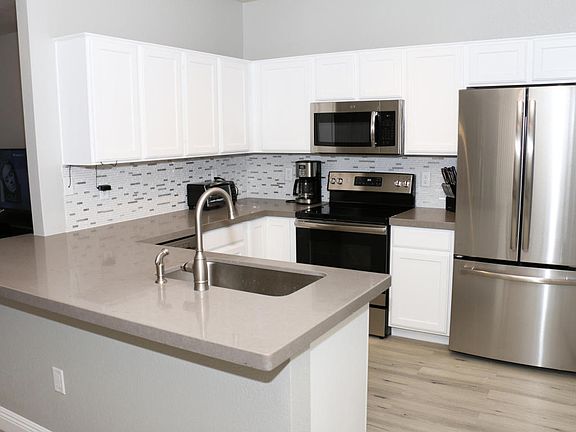 4th image of 6920 E 4th St Unit 208
