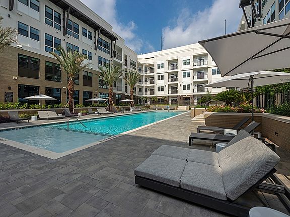 Enjoy sunny days by the resort-style pool