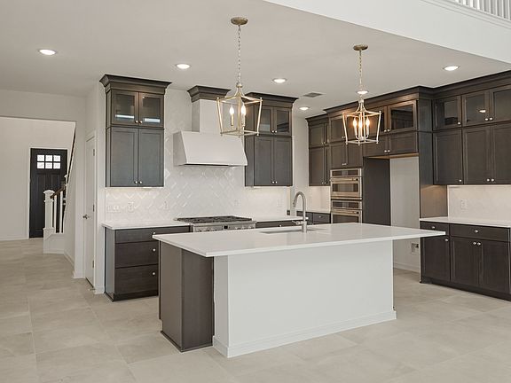 Kitchen featuring vast island