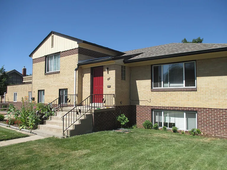 Frontyard and 1 of 2 private entrances into the apartment (red door).