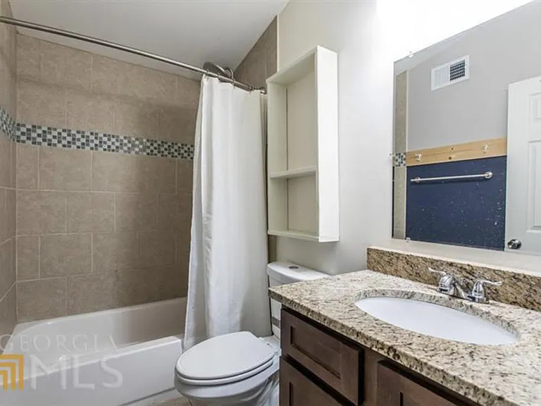 Both Bathrooms have similar finishes, tile, granite countertops, tubs, and upgraded shower heads.