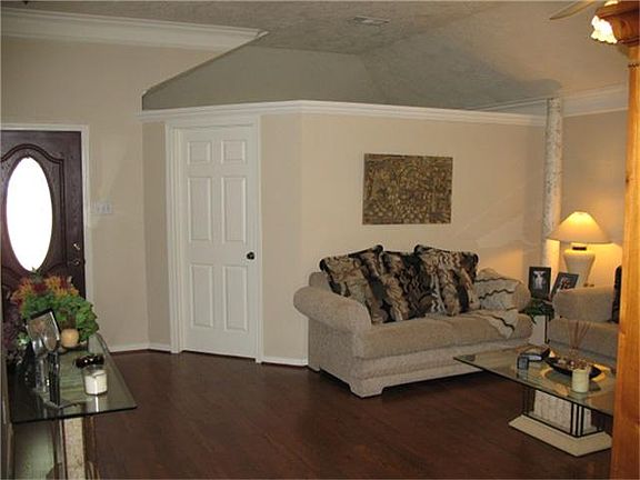 FRONT LIVING ROOM WITH ENCLOSED STUDY