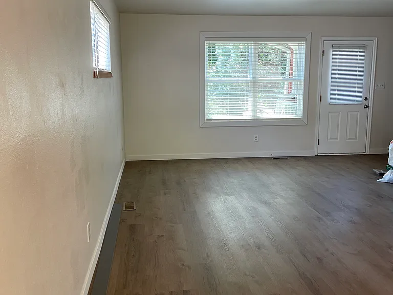 Living room area with new luxury vinyl flooring