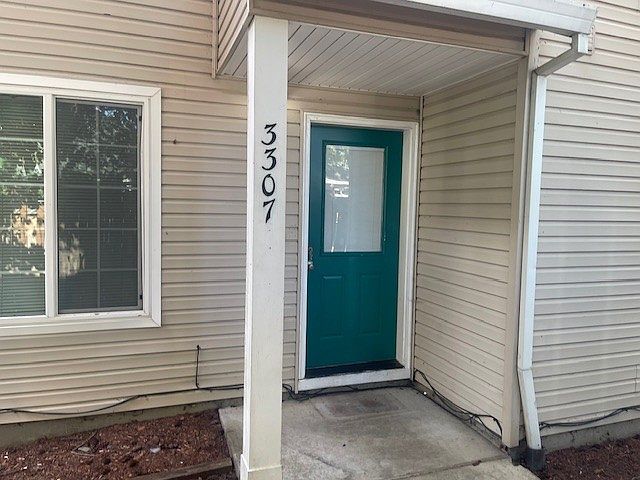 Front door, property is a duplex