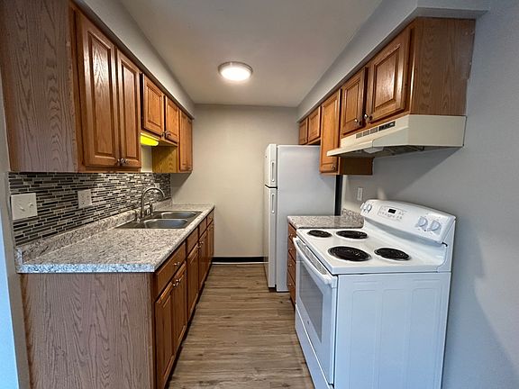 2 of 3 kitchen options
Oak kitchen includes fridge, oven, updated countertops and backsplash