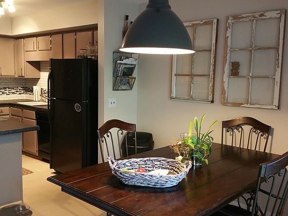 Bright Large Dining Room
						:
						Fresh paint, double glass doors to patio, counter/bar seating, open to kit + LR