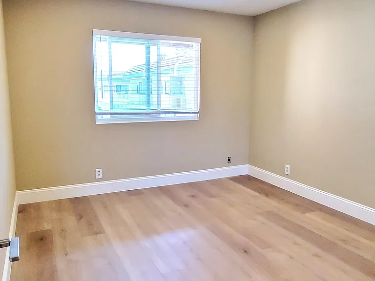 Spacious bedroom #2 with brand new laminate flooring and blinds