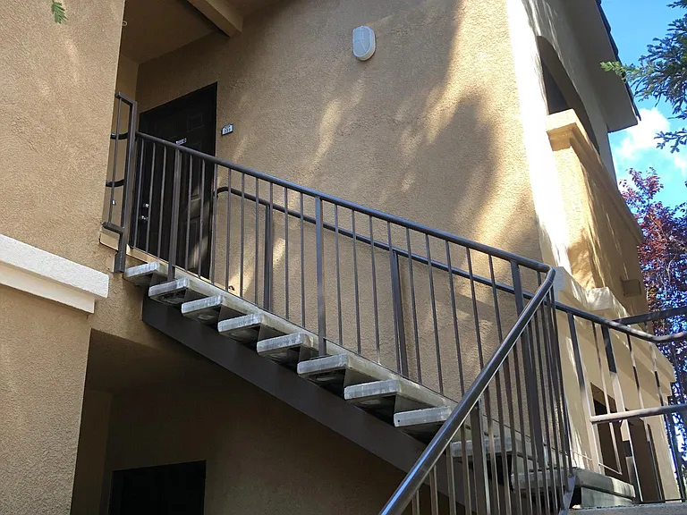 View of Condo. Upstairs unit with balcony.