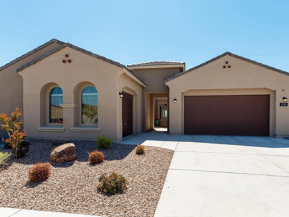 Front - 3 car garage, low maintenance landscape