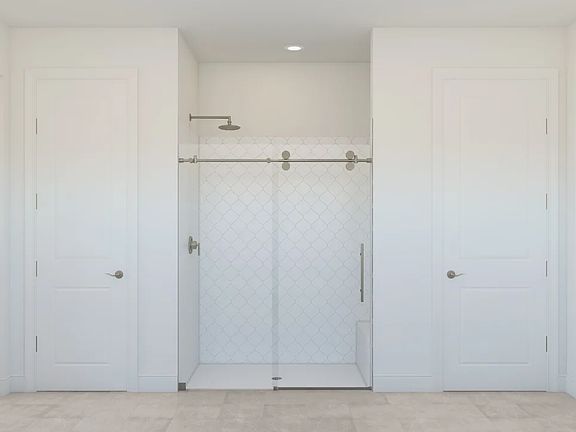 Primary bath with glass shower enclosure