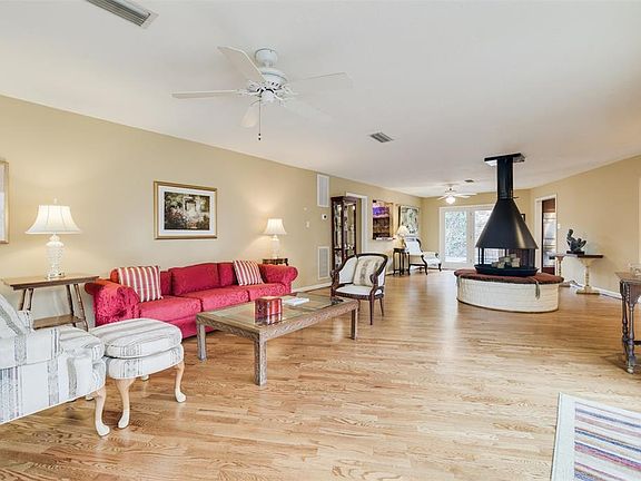 The OPEN floorplan gives you the FLEXIBILITY to use the LARGE spaces in many different ways and gorgeous HARDWOOD floors flow throughout.