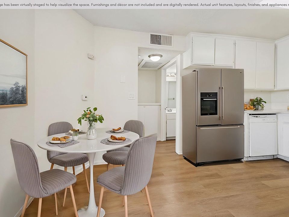 Open kitchen and dining area featuring ample cabinet space and a functional layout.