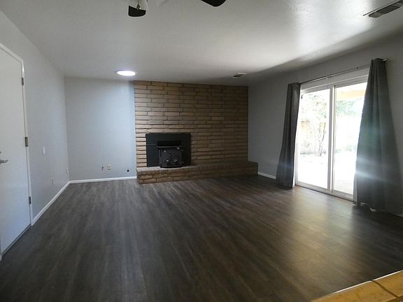 Family/dining room has a wood stove and access to back yard.