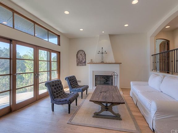 Formal Living Room with fireplace and balcony