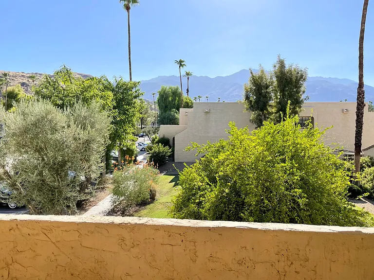 Patio view overlooking Mount Saint Jacinto. The Hope Residence and golf course are also visible.