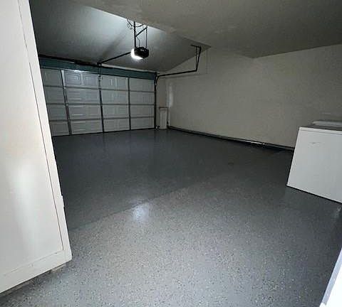 garage with washer/dryer and new epoxy flooring