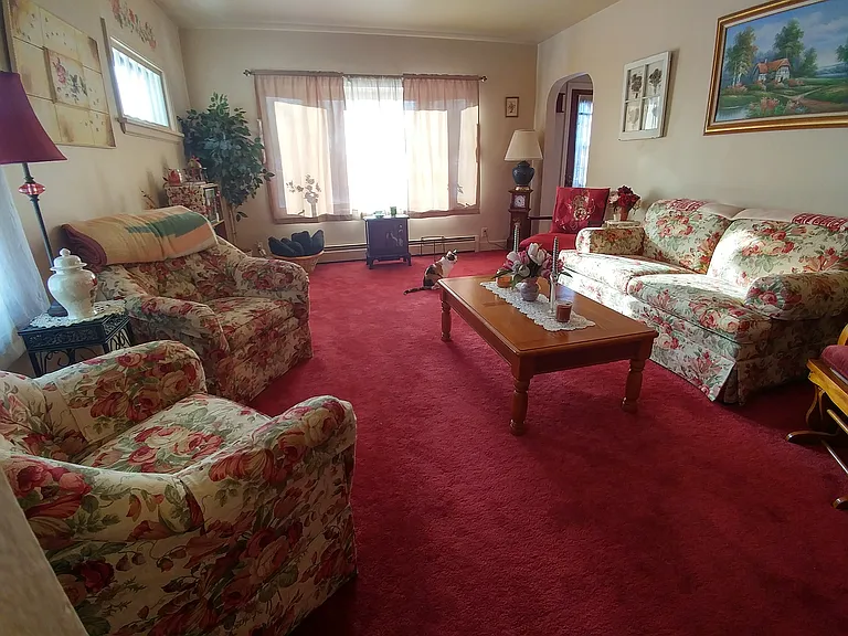 Living room (the red carpet is getting replaced with a neutral LVP)