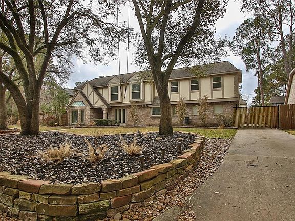 The home features a rear entry garage with a remote control gate for added privacy.