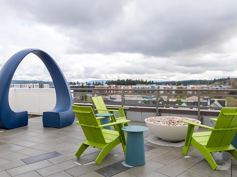 Take in mountain and wooded hillside views from the rooftop at Modera River Trail
