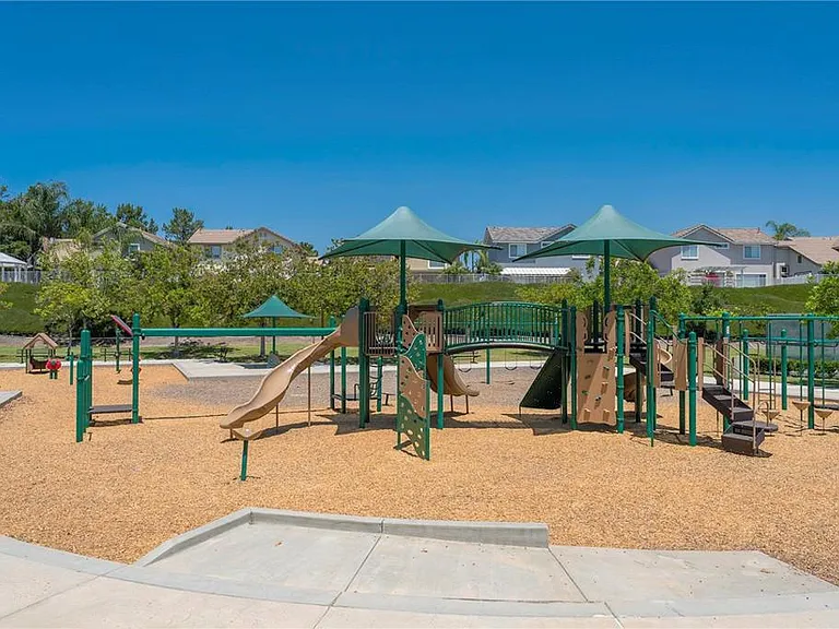 Playgrounds are available in the park directly across the street from condo complex.
