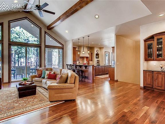 Gleaming walnut floors & walk-out to covered composite deck