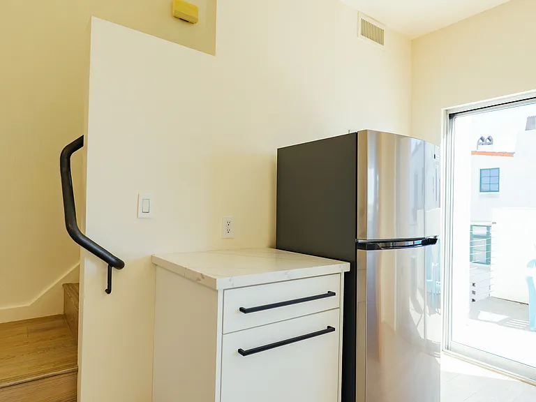 New stainless steel appliances with custom cabinetry.