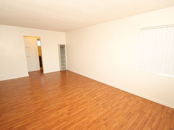 Big living room, nice laminate wood flooring