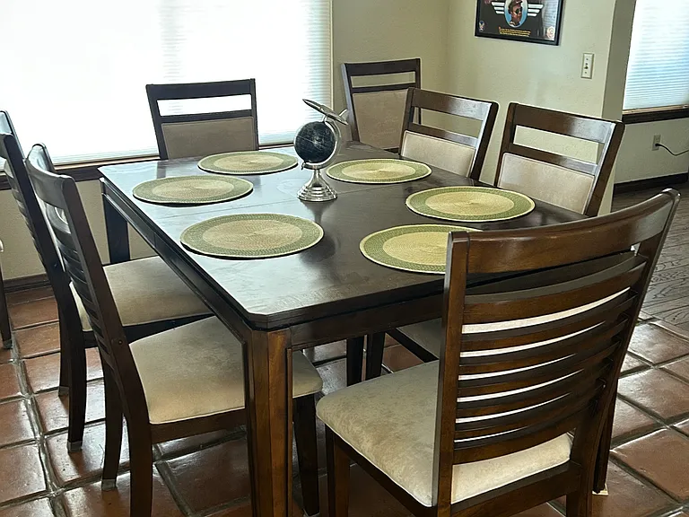 Formal dining room for six with 2 extra chairs when a leaf is installed.
