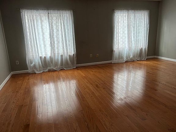 The apartment size is 20'x40' width x Length covered with wall to wall wood floor. A large living room.