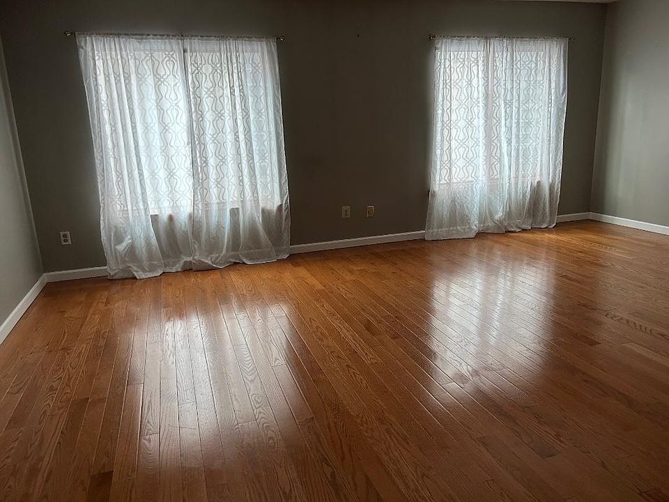 The apartment size is 20'x40' width x Length covered with wall to wall wood floor. A large living room.