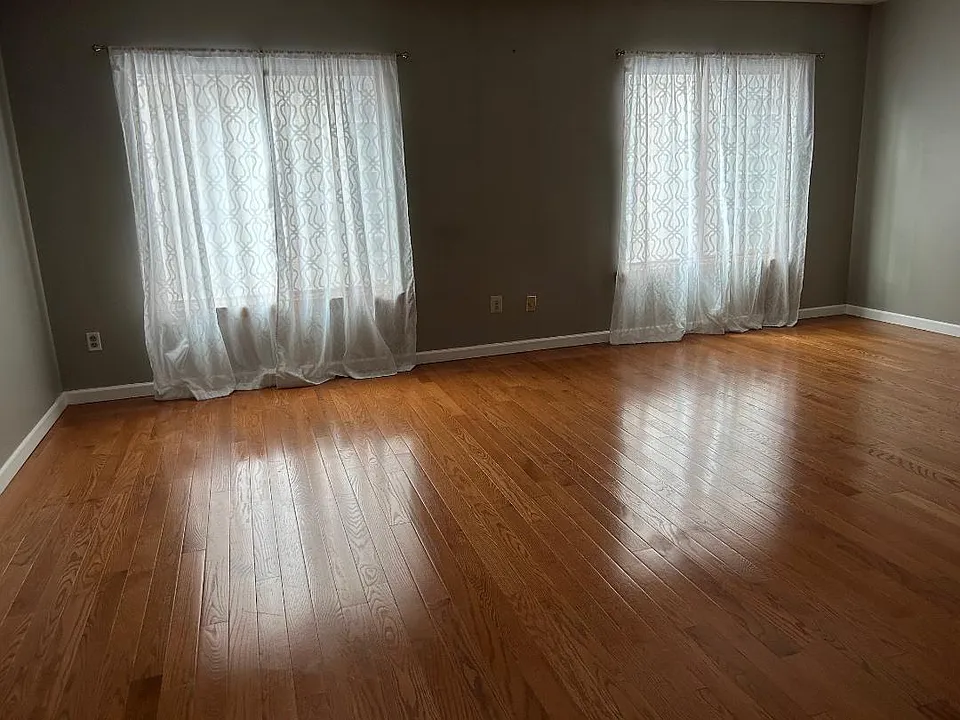 The apartment size is 20'x40' width x Length covered with wall to wall wood floor. A large living room.