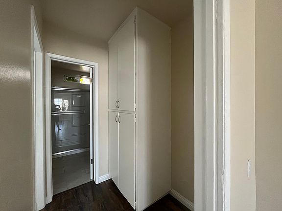 pantry/utility closet on right, on left entry to bathroom and to bedroom