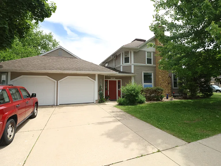 Full view of front with shared garage
