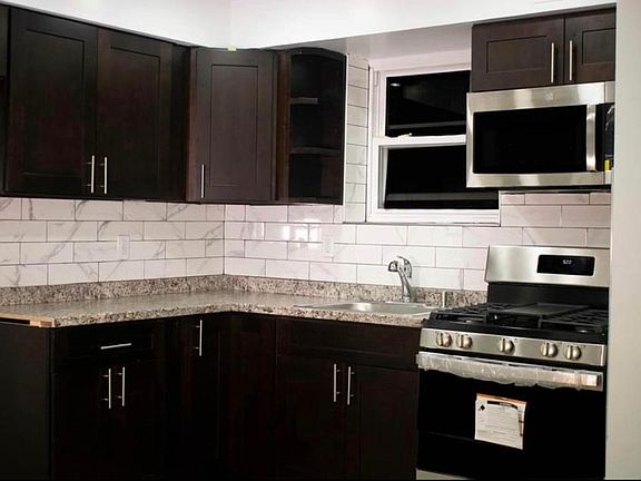 Kitchen view, refrigerator is to the left.