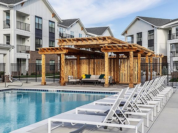 The saltwater pool is surrounded by a sundeck and luxurious cabanas.