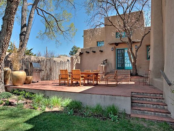 Accessible via the dining room or kitchen, this impressive patio encourages alfresco living and ente