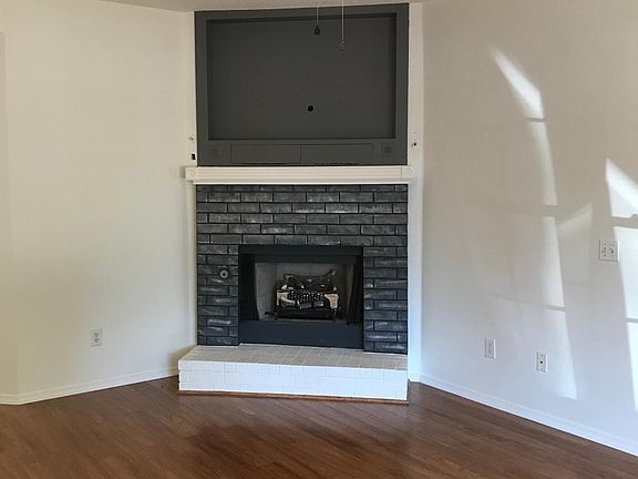 Living room with built-in cabinet for big screen TV. Wired for surround sound.