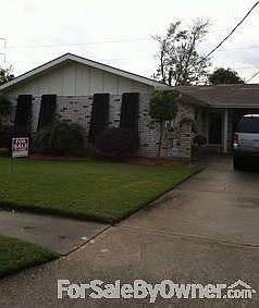 Front of House
						:
						Parking for three cars. One under carport.