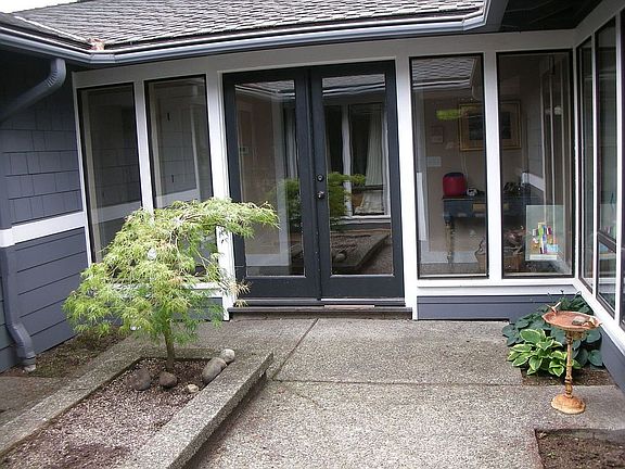 Courtyard front entry w/french doors