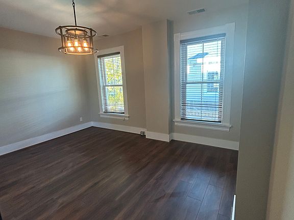 Bedroom with ensuite laundry and bathroom.