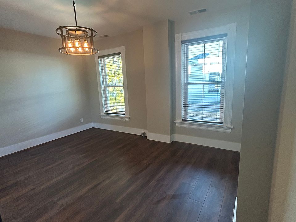 Bedroom with ensuite laundry and bathroom.