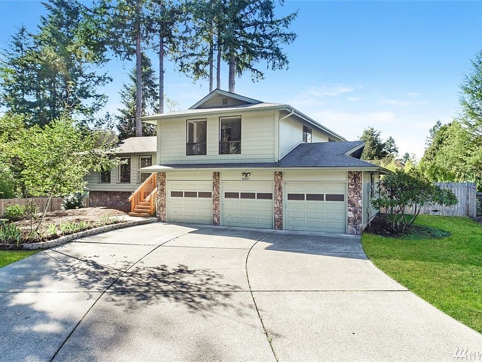 Front of home. Large driveway with 3 car garage.
