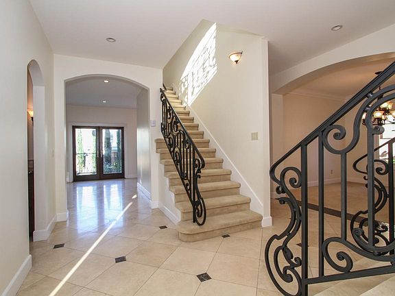 Foyer with formal Dining Room and Dual Stair Case leading to second level and private Living Room.