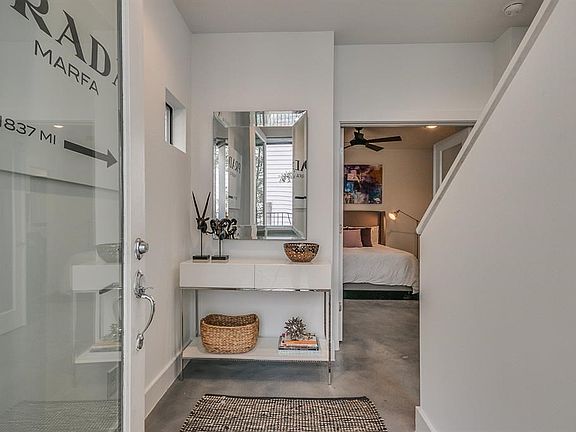 Light filled entry with polished concrete floors on the first level.
