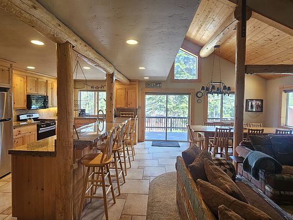Kitchen, Bar, Living and Dining Area