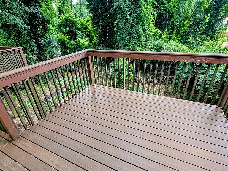 Back deck, overlooking three acres of green space, with easy to clean and splinter free enhanced composite decking boards.